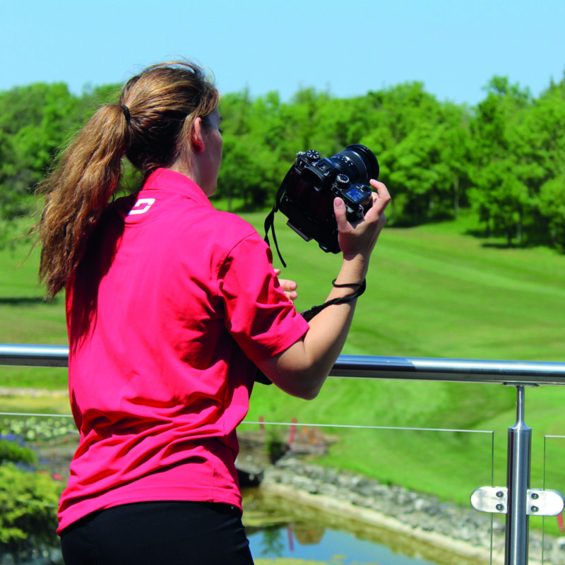 Mica, our Photographer, preparing to take a photo of a beautiful field.