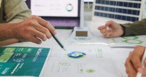 A desk with paperwork, showing people devising a green marketing strategy